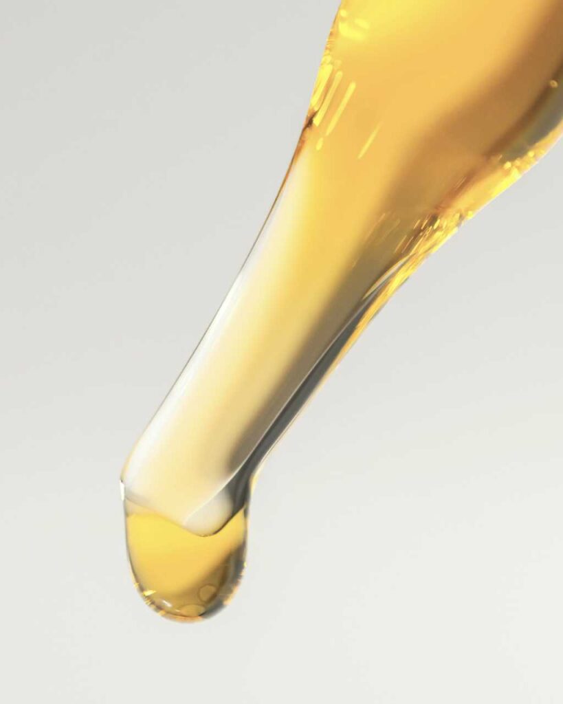 Close-up of hemp oil in a glass dropper.